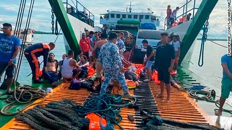 The Philippine coast guard checks rescued passengers at the port of Real in Quezon province on May 23.