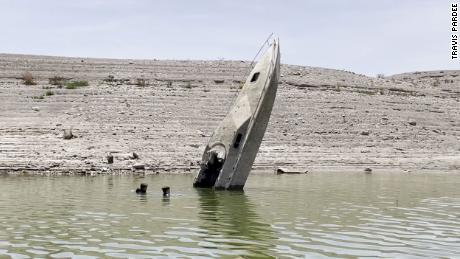 Formerly sunk boats are resurfacing at Lake Mead as the water level drops. 