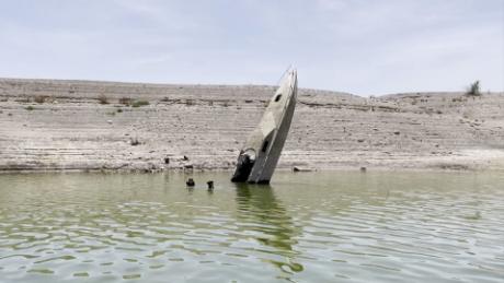 Watch as a sunken boat emerges from Lake Mead