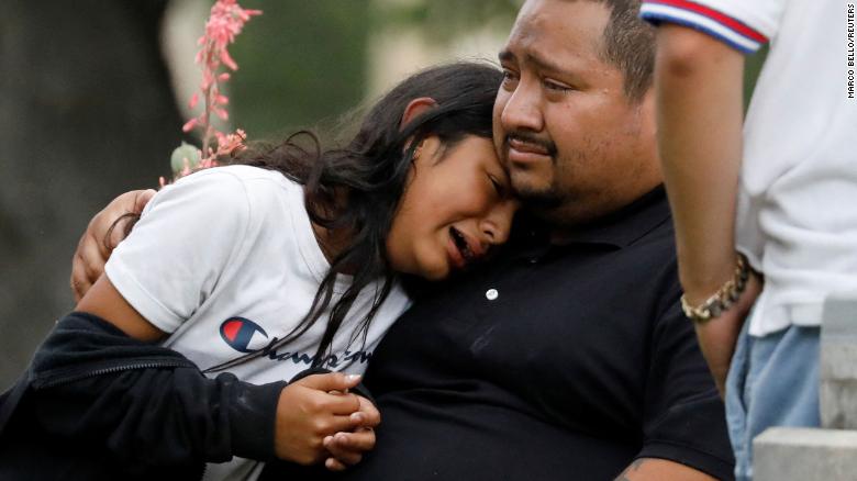 People react outside the SSGT Willie de Leon Civic Center, where students were transported after the school shooting in Uvalde, Texas, on Tuesday, May 24.