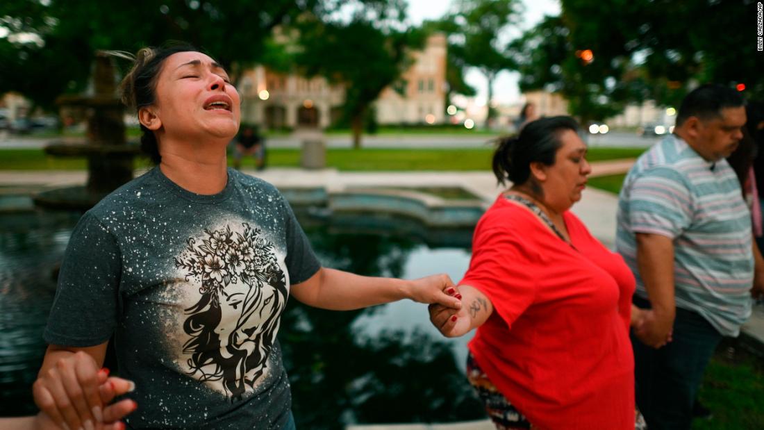 Kladys Castellón prays during a vigil that was held in Uvalde on Tuesday.