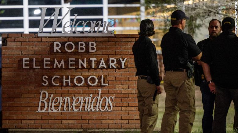 UVALDE, TEXAS - MAY 24: Law enforcement officers speak together outside of Robb Elementary School following the mass shooting at Robb Elementary School on May 24, 2022 in Uvalde, Texas. According to reports, 19 students and 2 adults were killed, with the gunman fatally shot by law enforcement. (Photo by Brandon Bell/Getty Images)