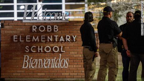 Law enforcement officers outside of Robb Elementary School following the mass shooting on Tuesday.