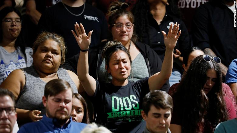 People attend a vigil Wednesday for those killed at Robb Elementary School in Uvalde, Texas.