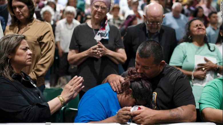 People react during a prayer vigil in Uvalde, Texas, Wednesday, May 25, 2022. 
