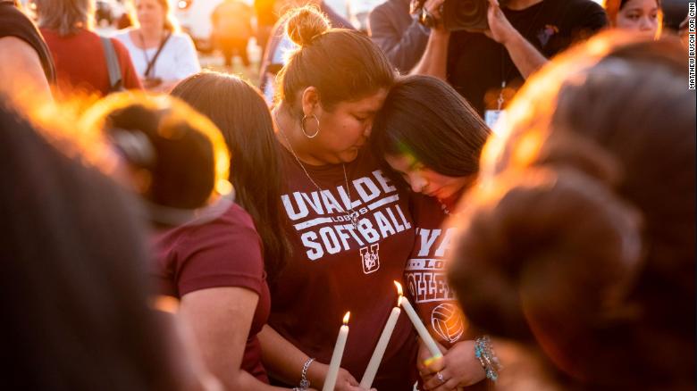 Attendees light candles during a memorial in Uvalde, Texas, Wednesday, May 25. 