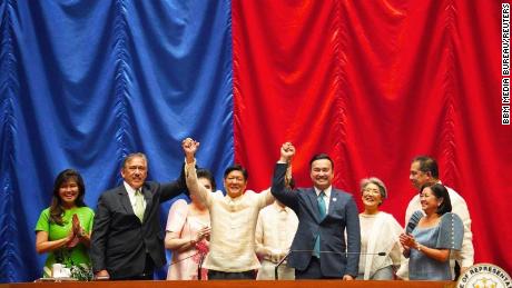 Ferdinand &quot;Bongbong&quot; Marcos Jr. raises hands with Senate President Vicente Sotto III and House Speaker Lord Allan Velasco during his proclamation, at the House of Representatives, in Quezon City, Metro Manila, Philippines, May 25, 2022.  