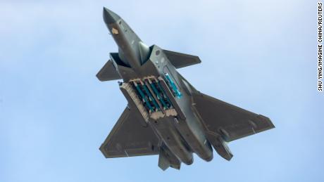 A guided-missile-armed J-20 stealth fighter jet of the Chinese People&#39;s Liberation Army (PLA) Air Force performs at Airshow China 2018.
