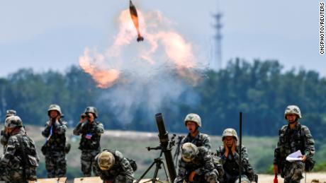 Soldiers of Chinese People's Liberation Army (PLA) fire a mortar during a live-fire military exercise in Anhui province, China May 22, 2021. 
