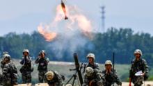 Soldiers of Chinese People&#39;s Liberation Army (PLA) fire a mortar during a live-fire military exercise in Anhui province, China May 22, 2021. 