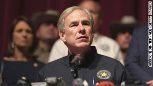 Texas Governor Greg Abbott with other officials, holds a press conference to provide updates on the Uvalde elementary school shooting, at Uvalde High School in Uvalde, Texas on May 25, 2022. - The tight-knit Latino community of Uvalde was wracked with grief Wednesday after a teen in body armor marched into the school and killed 19 children and two teachers, in the latest spasm of deadly gun violence in the US. (Photo by allison dinner / AFP) (Photo by ALLISON DINNER/AFP via Getty Images)