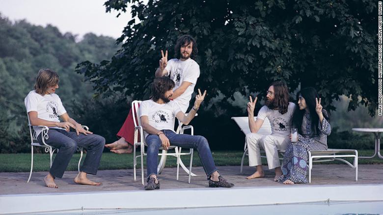 Left to right: drummer Alan White, Eric Clapton (seated), bassist Klaus Voorman, John Lennon and Yoko Ono in Toronto in 1969 