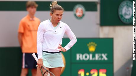 Halep looks on during her defeat against Qinwen Zheng.