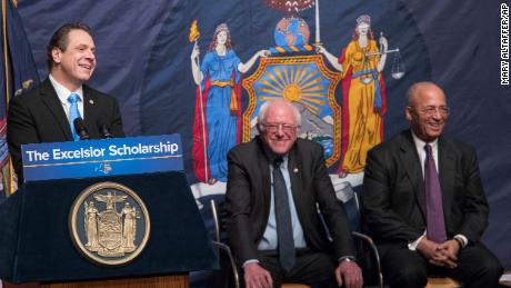 Then New York Gov. Andrew Cuomo, left, announced his proposal for free tuition at state colleges on Jan. 3, 2017 to hundreds of thousands of low- and middle income residents. He was joined by Vermont Sen. Bernie Sanders, center, and Chairperson of the Board of Trustees of The City University of New York William C. Thompson.