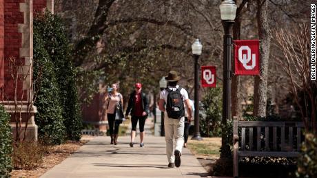 Students walk on campus at the University of Oklahoma in March 2015.