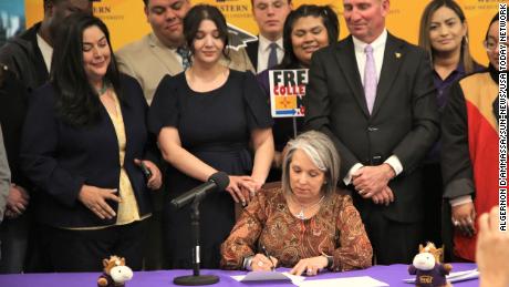 New Mexico Gov. Michelle Lujan Grisham signed SB 140, which expanded free college tuition to most residents, at Western New Mexico University in Silver City on March 4.