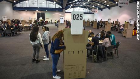 People vote at a polling station in Bogota during the Colombian presidential election, on May 29, 2022. 