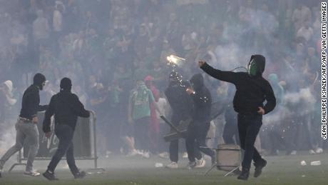 A Saint-Étienne fan throws a projectile on the pitch at the Geoffroy Guichard Stadium after the club&#39;s relegation to Ligue 2.