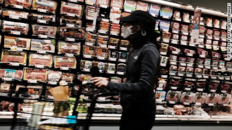 People shop at a grocery store on May 12, 2022, in New York City. 