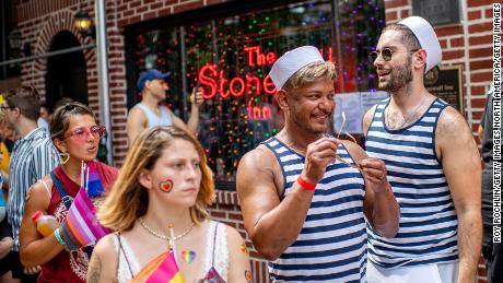 People celebrate outside the historic Stonewall Inn during the New York Pride March on June 27, 2021, in New York City. 