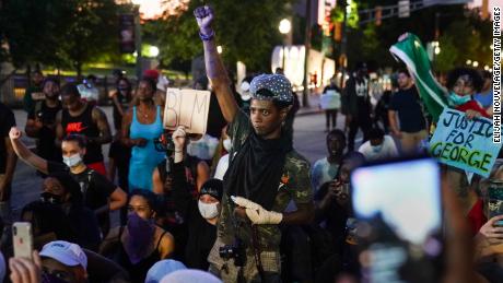 A protester raises his fist during a demonstration on May 31, 2020, in Atlanta in the wake of George Floyd&#39;s death. 