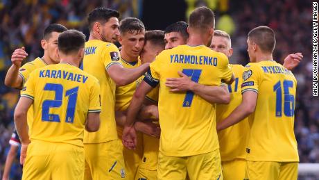 Yarmolenko is mobbed by his teammates after scoring the opener. 