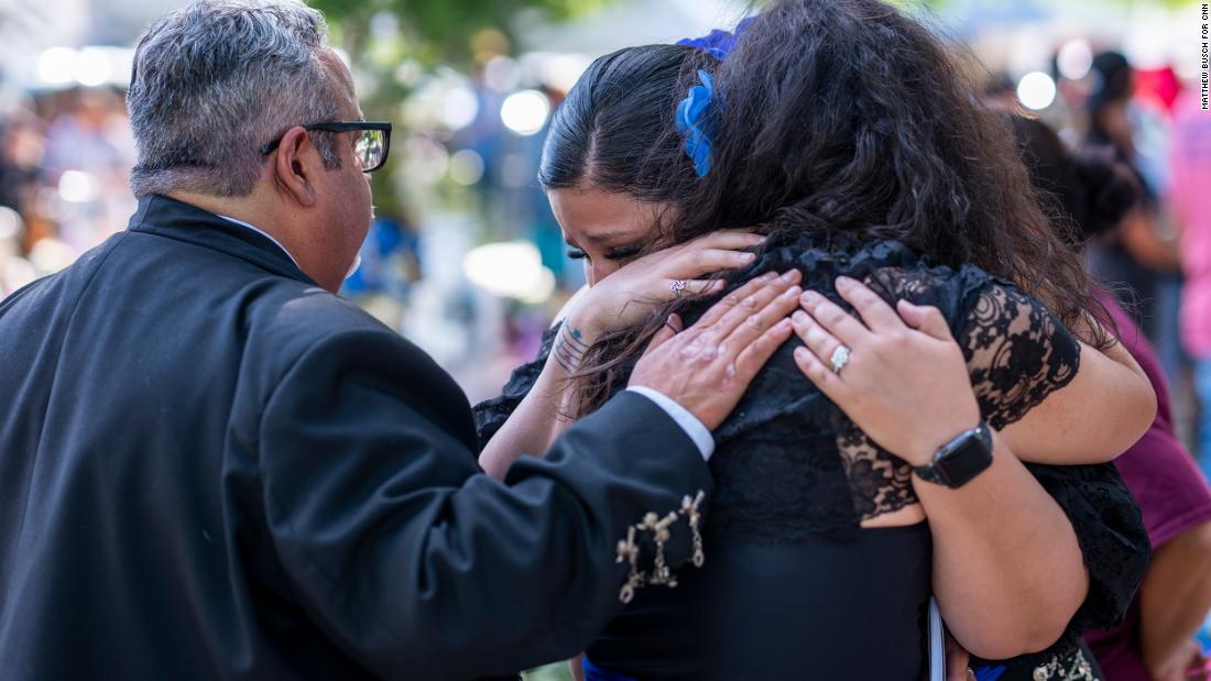Celia Correa Sauceda, right, hugs her friend Stacey Mazuca after they and other mariachi musicians from San Antonio performed during a memorial in Uvalde on Wednesday, June 1. Sauceda, who plays violin, is an elementary teacher in San Antonio. She said she was in Uvalde to be a voice. &quot;We cannot forget what happened, and it needs to stop,&quot; Sauceda said.