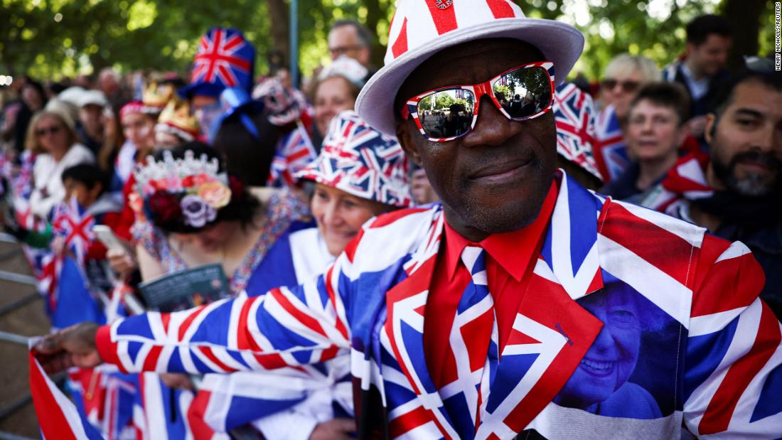 A man wears a Union Jack suit as people gather on The Mall for jubilee celebrations on Thursday.