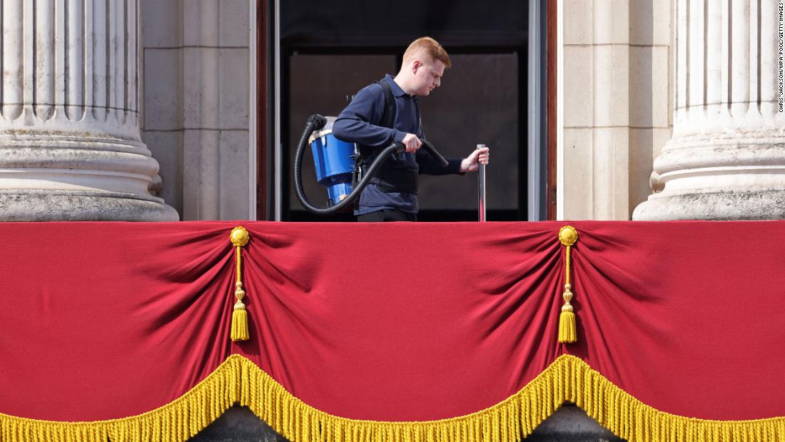 A member of the Buckingham Palace staff cleans the balcony ahead of the Trooping the Colour parade on Thursday.