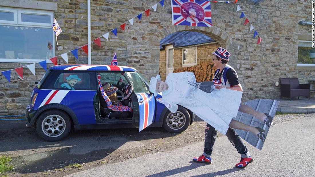 Anita Atkinson, who has collected more than 12,000 items of royal memorabilia, makes her way to a tea party in Durham on Thursday.