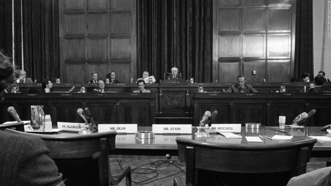 US Rep. Wright Patman, a Texas Democrat who was chairman of the House Banking Committee, faces four empty chairs after some Nixon aides refused to testify about the Watergate incident in October 1972. Patman said the administration had   &quot;pulled down an iron curtain of secrecy.&quot;