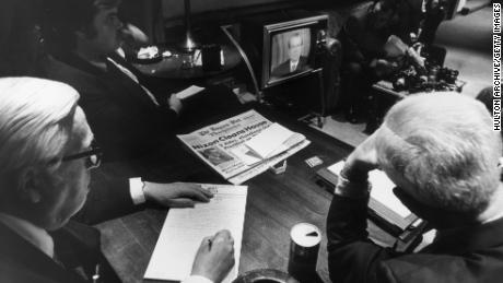 White House reporters watch President Richard Nixon on TV as he told the nation of White House involvement in the Watergate scandal on April 30, 1973.