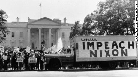 A demonstration outside the Whitehouse in support of impeaching Nixon following the Watergate revelations.   