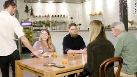 Erin Flavin, seated facing the table, started researching non-alcoholic alternatives to booz when she quit drinking. 