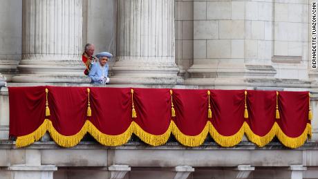 The Queen walks out onto the Buckingham Palace balcony during the Trooping the Colour parade. 