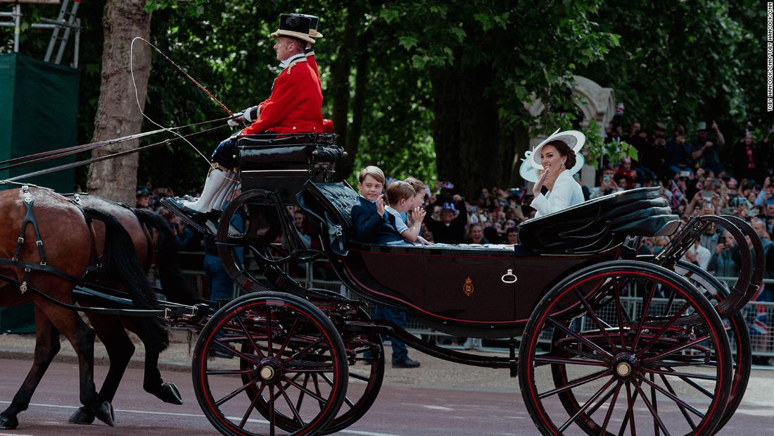Catherine, the Duchess of Cambridge, waves during a carriage procession on Thursday. Joining her on the carriage were her three children — Prince George, Prince Louis and Princess Charlotte — as well as Camilla, the Duchess of Cornwall.
