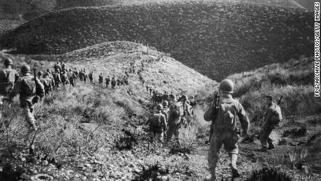 A Ranger Battalion on a speed march over hilly terrain during a manoeuvre operation on January 20, 1943, in North Africa.