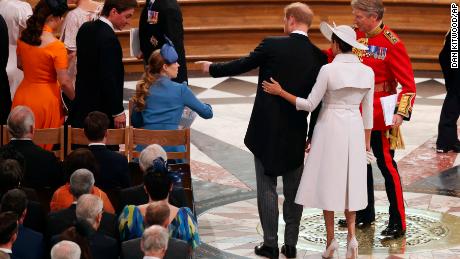 The couple take their seats within St Paul's.