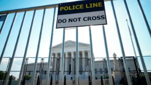 WASHINGTON, DC - JUNE 1: A view of the U.S. Supreme Court through security fencing on June 1, 2022 in Washington, DC. The country continues to wait for an official decision in the Dobbs v. Jackson Womens Health Organization case that could essentially overturn the landmark Roe v. Wade abortion decision. According to media reports, Supreme Court officials are escalating their search for the source of the leaked draft opinion in the case. The justices have 33 remaining cases to be decided by the end of June or the first week in July. The issues include abortion, guns, religion and climate change. (Photo by Drew Angerer/Getty Images)