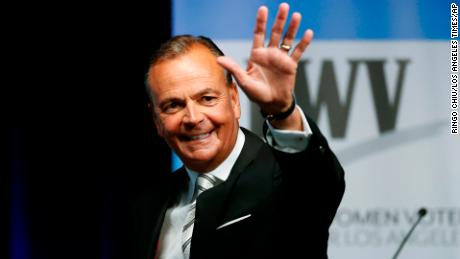 FILE - Businessman Rick Caruso waves at the start of a mayoral debate at the Student Union Theater on the California State University, Los Angeles campus on Sunday, May 1, 2022. Los Angeles is a heavily Democratic city, but voters this year could take a right turn. Caruso, a billionaire former longtime Republican who sits on the Ronald Reagan Presidential Foundation board, is a leading candidate for mayor and is promising to expand, not defund, police. (Ringo Chiu/Los Angeles Times via AP, File)