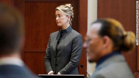 (Left) Amber Heard and Johnny Depp watch as jurors enter the courtroom after a break at Fairfax County Court in Virginia on May 16. 