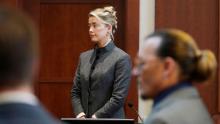 (From left) Amber Heard and Johnny Depp watch as the jury enters the courtroom on May 16 after a break in Fairfax County Courthouse in Virginia. 
