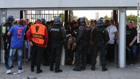 Police patrol the gates at Paris&#39; Stade de France. 
