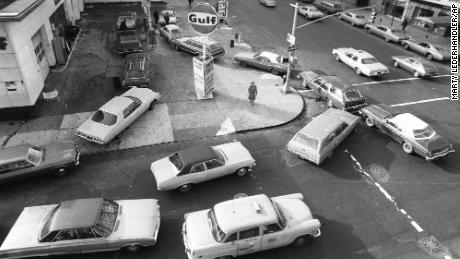 Cars line up in two directions at a gas station in New York City in 1973. As gas sprices spiked during the 1970s, restrooms fell off.