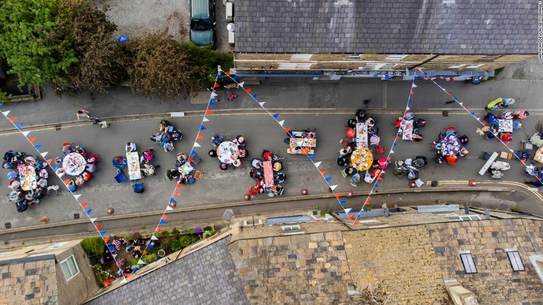 People gather for a street party in Hayfield, England, on Saturday.