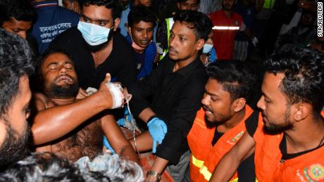 An injured victim is brought to a hospital after a massive fire broke out in an inland container depot at Sitakund, near the port city Chittagong, Bangladesh, June 5, 2022. REUTERS/Stringer NO RESALES. NO ARCHIVES