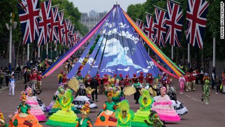 Sunday's pageant featured a carnival procession along the Mall including giant puppets and celebrities that helped depicted key moments from the Queen's seven decades on the throne. 