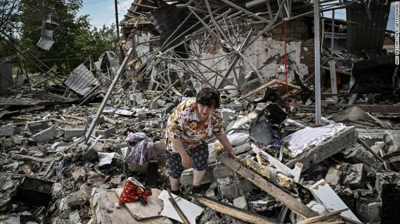 Residents look for belongings in the rubble of their home after a strike destoyed three houses in the city of Sloviansk in the eastern Ukrainian region of Donbas on June 1.