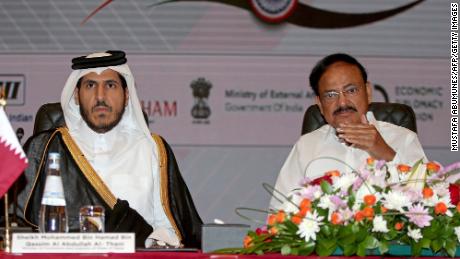 Qatar&#39;s Minister of Commerce and Industry Mohammed Bin Hamad al-Thani (left) and India&#39;s Vice President Venkaiah Naidu (right) take part in a business forum in Doha on June 5. 