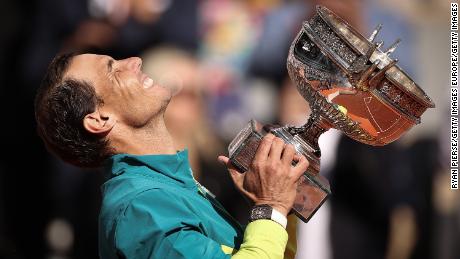 Nadal holds aloft La Coupe des Mousquetaires (The Musketeers&#39; Trophy) at Roland Garros. 